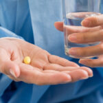 Doctor holding zinc supplements in hand