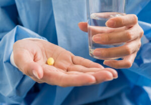 Doctor holding zinc supplements in hand